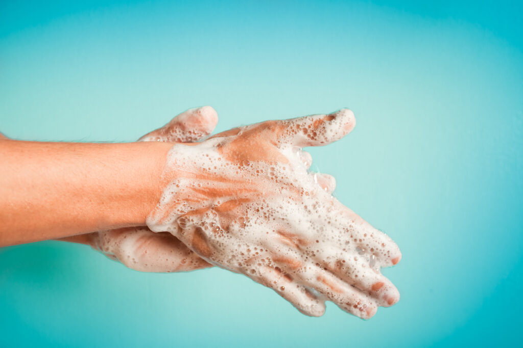A person washing their hands to prevent salmonella infection